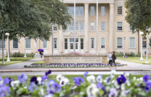 Sadler hall at TCU with students walking in front